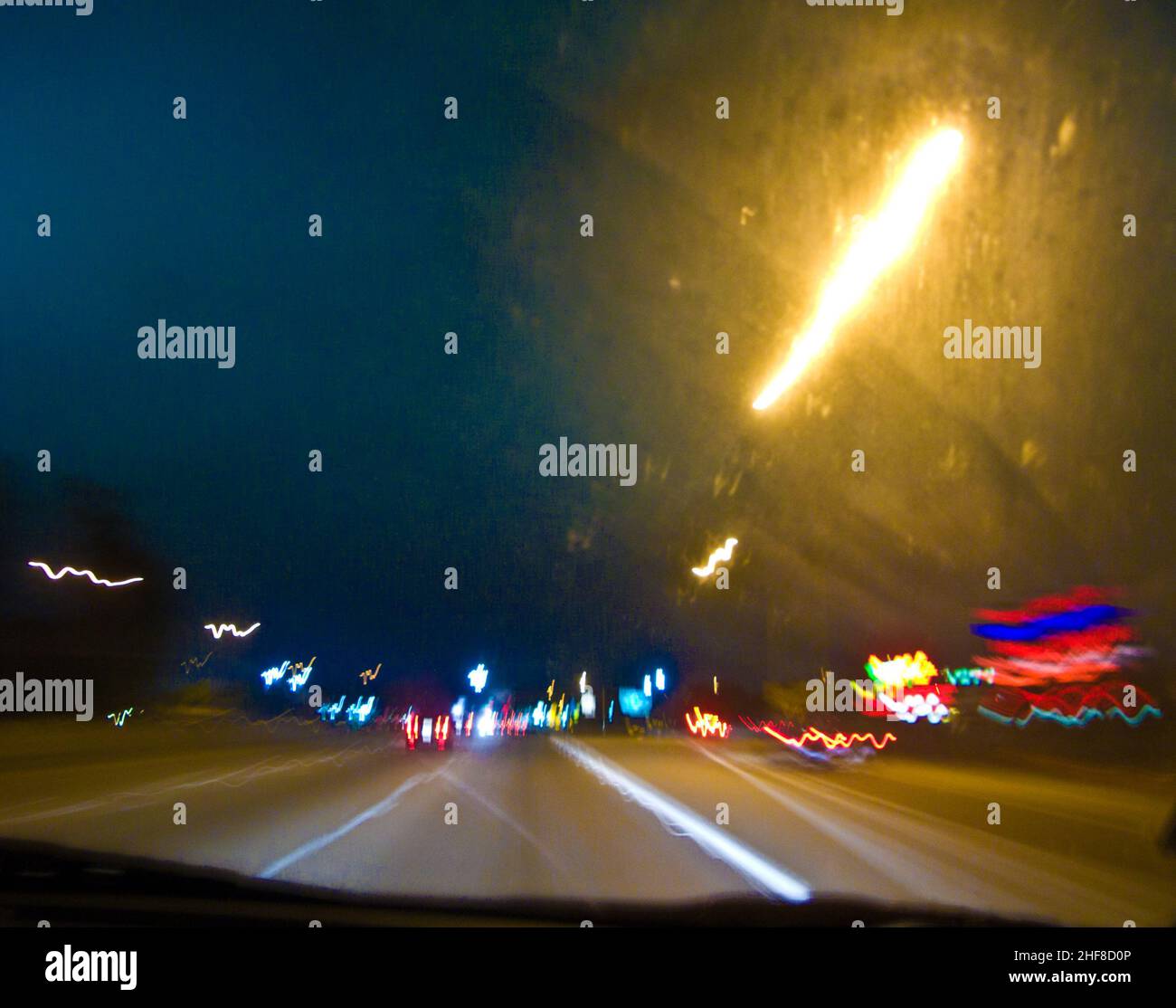 view by night and rain thru the front window of the car Stock Photo - Alamy