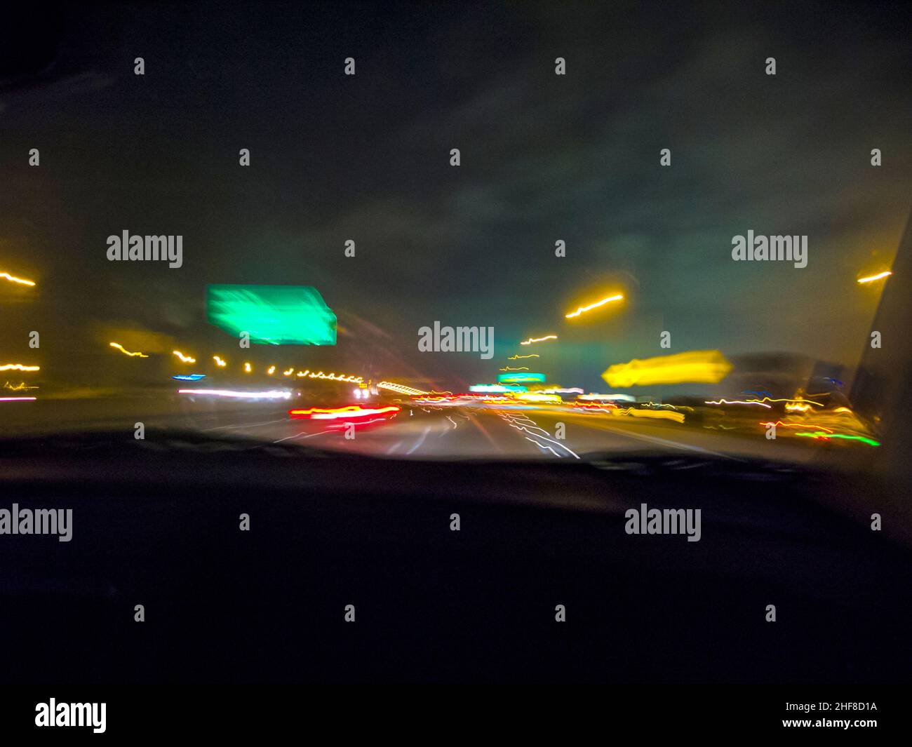 view by night and rain through the front window of the car Stock Photo ...