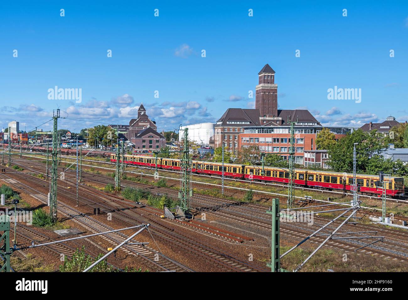 Berlin, Germany - October 6, 2021: Railroad station, administration building and S-Bahn train in the Westhafen harbor BEHALA, one of Germany’s largest Stock Photo