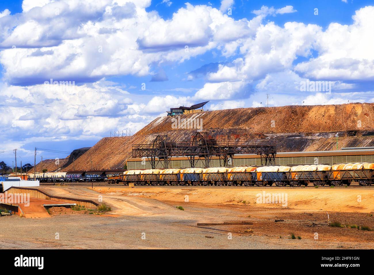 Railway freight trains with wagons of cargo off raw material ore mines in Broken Hill city, Australian OUtback. Stock Photo