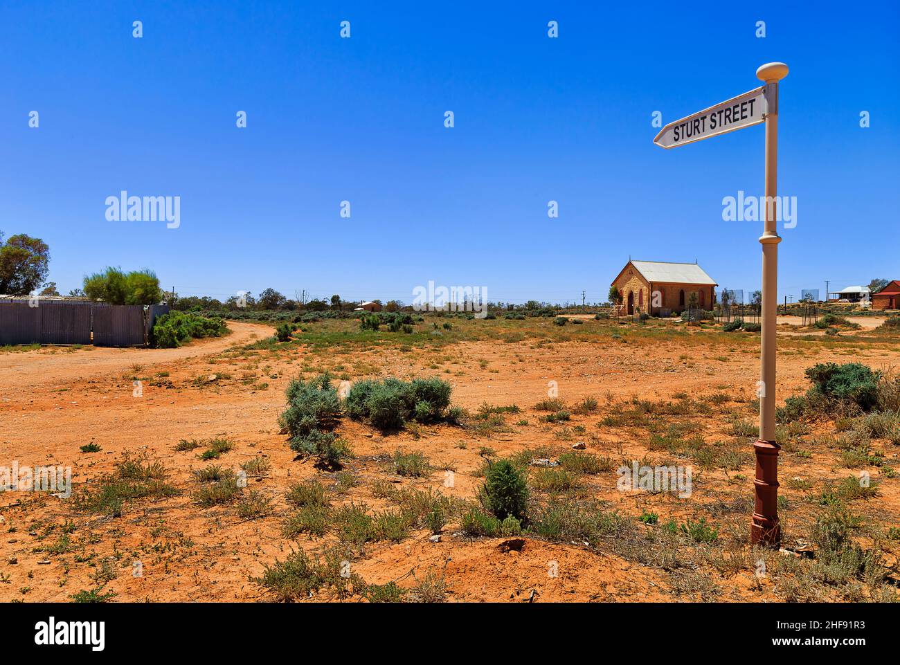 Street name sign post at unsealed corner of SIlverton ghost town at AUstralian outback. Stock Photo
