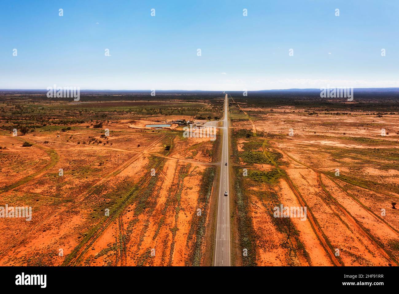Stop over rest area and fuel station roadhose motel on Barrier highway in far west outback of Australia - aerial landscape. Stock Photo