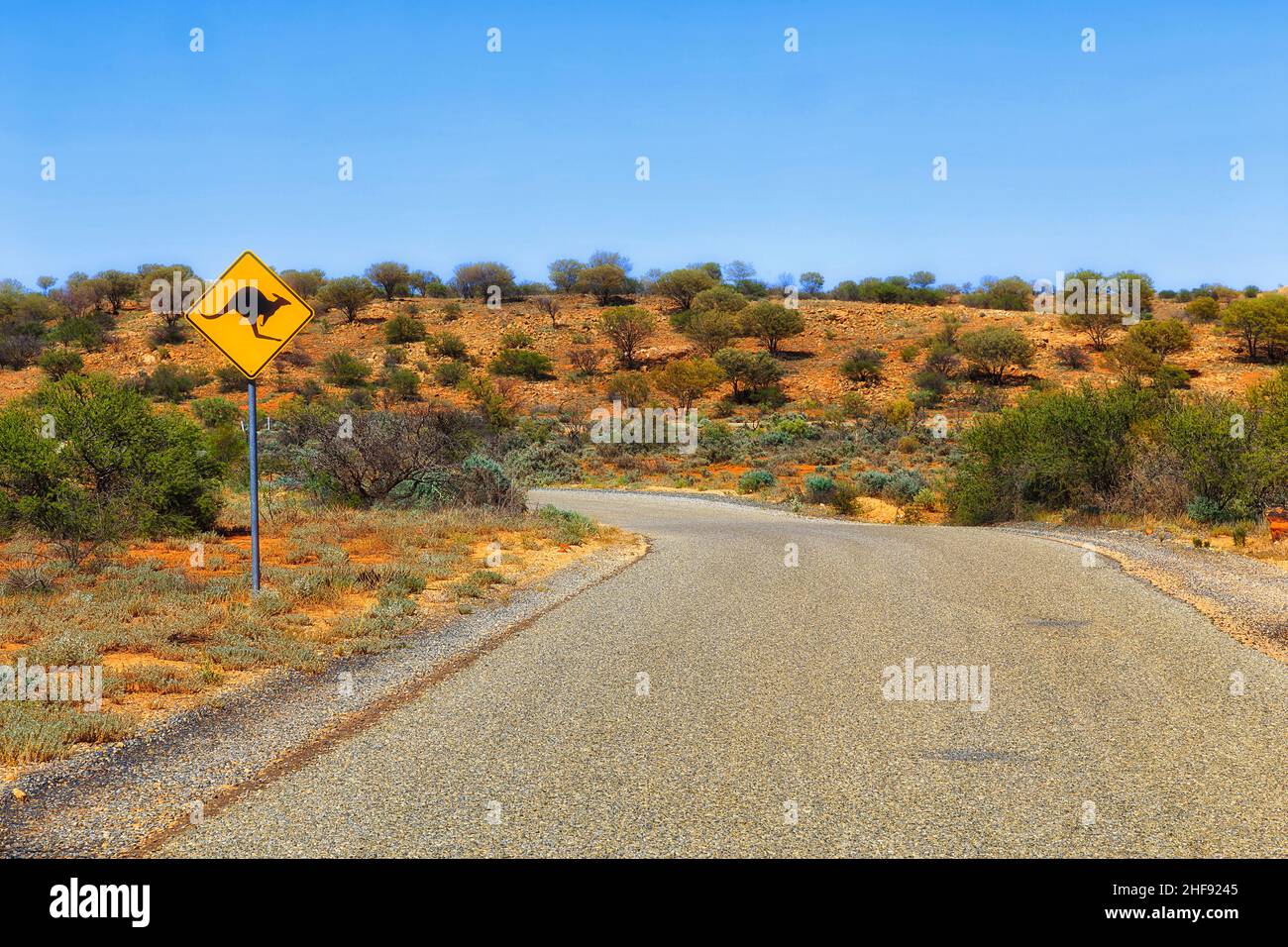 Warning roadsign kangaroo wildlife danger information sign on remote Silverton road near Broken hill in Australian outback. Stock Photo