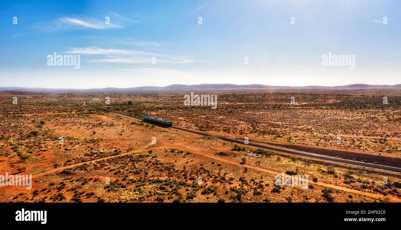 Aerial panorama of landscape with passenger Train out of broken hill in endless outback. Stock Photo