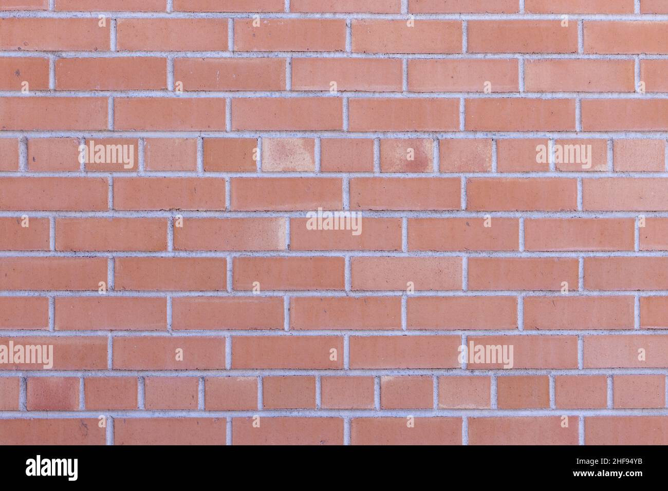 Layed bricks as a background wall with variegated colors Stock Photo
