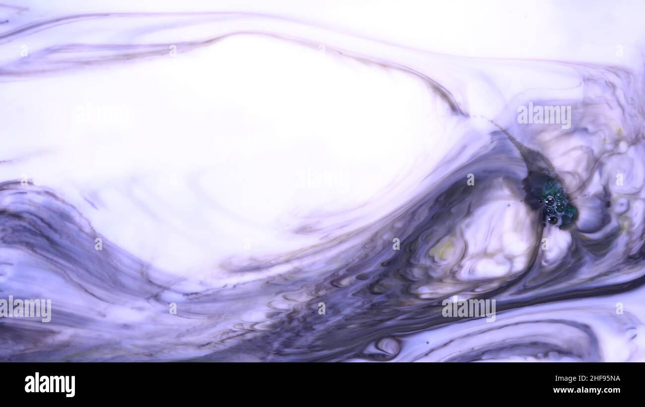 Beautiful motion of liquid paints in milky substance, art concept