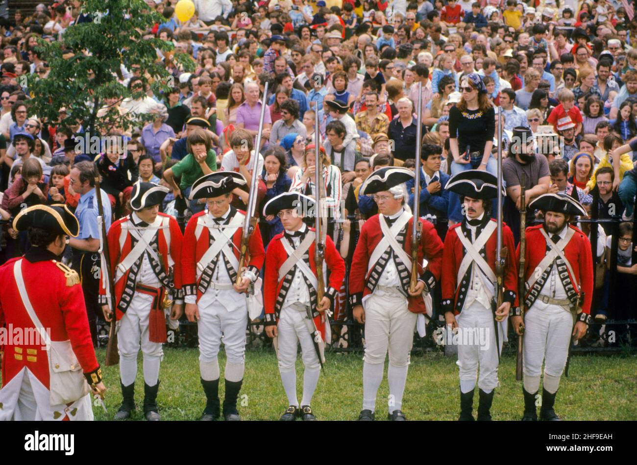 Uniformed volunteer actors stage a reenactment of the American Revolution Battle of Bunker Hill at the original location in Charlestown, MA. Stock Photo