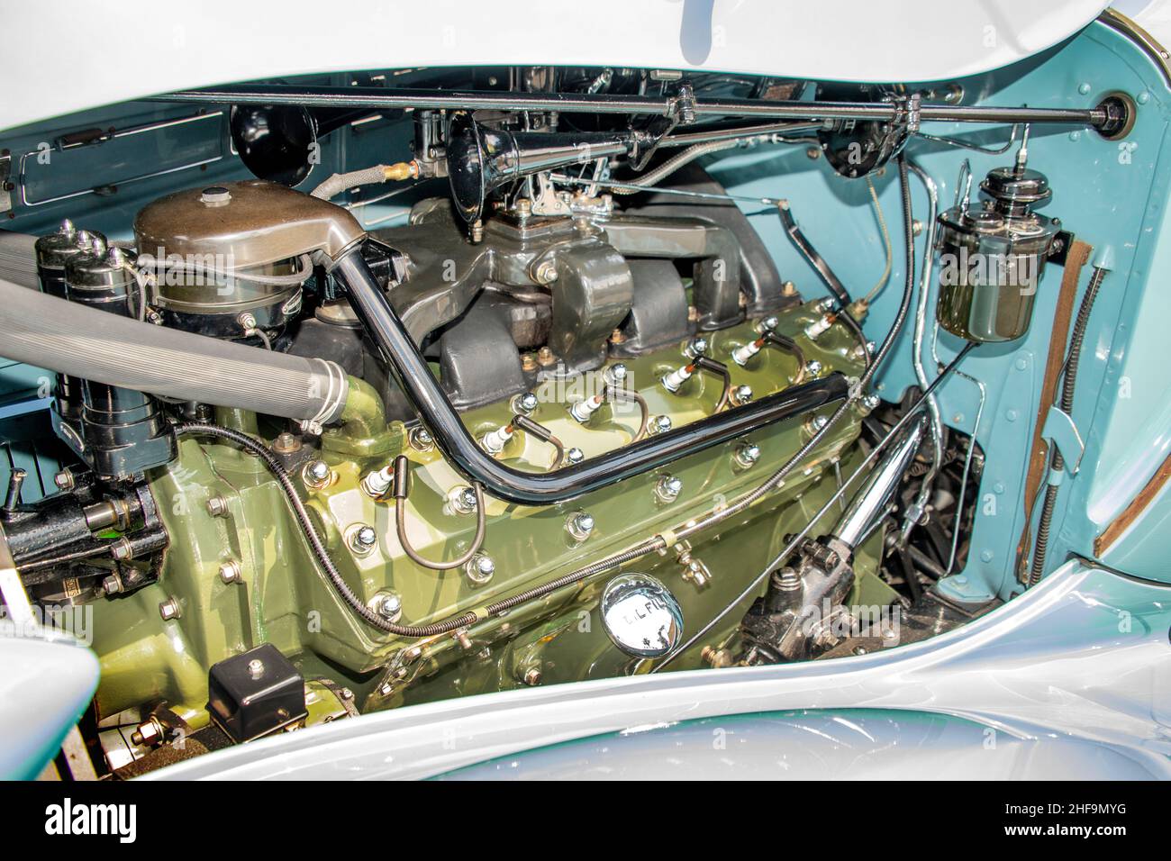 A massive V-12 engine powers a 1936 Packard roadster classic automobile. Stock Photo