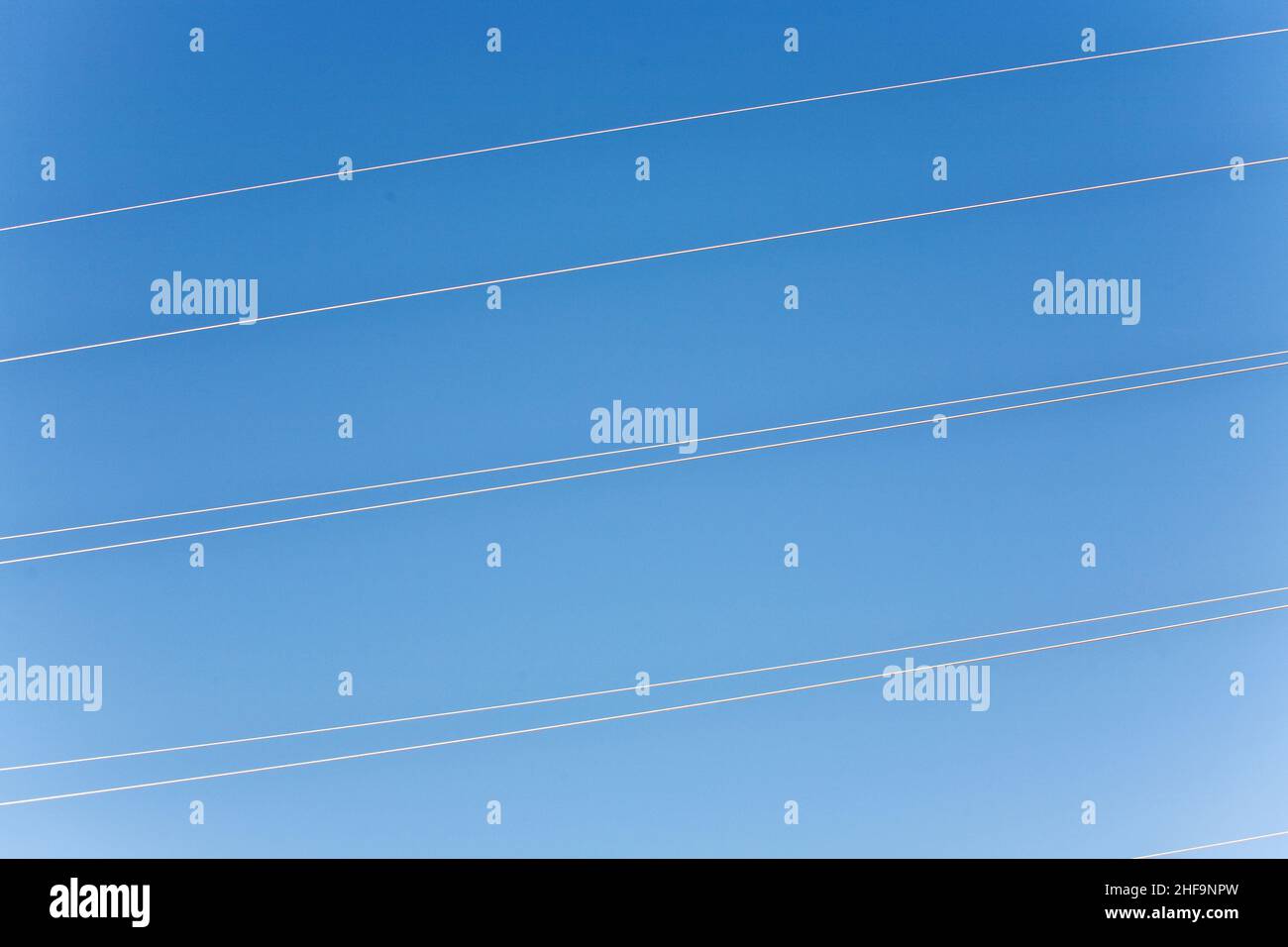 electricity high voltage tower with blue sky Stock Photo - Alamy