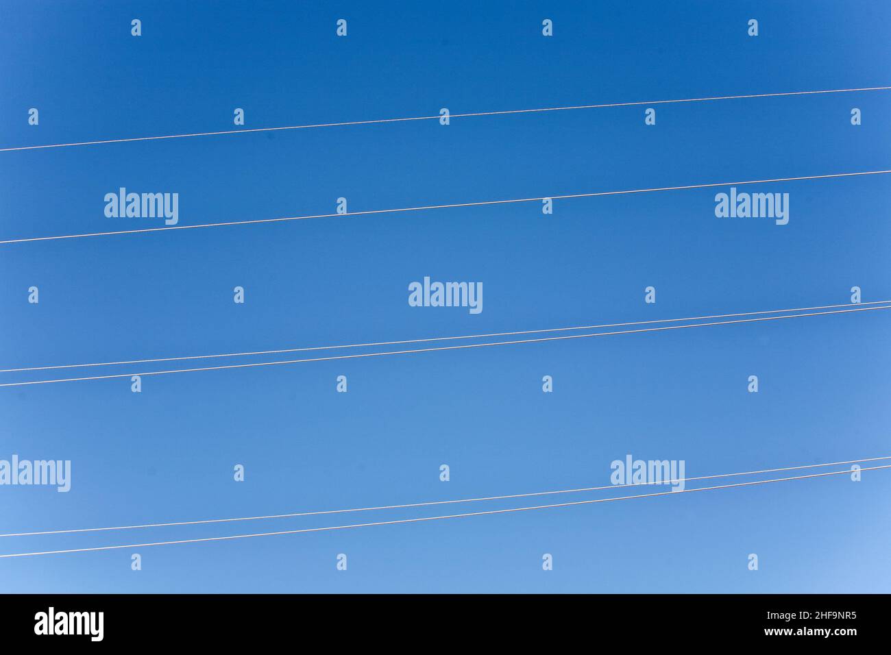 electricity high voltage tower with blue sky Stock Photo - Alamy