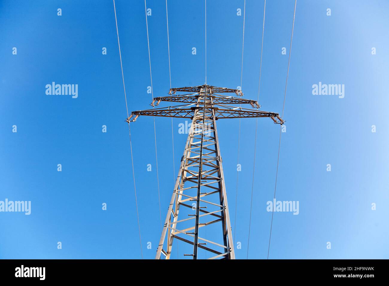 electricity high voltage tower with blue sky Stock Photo - Alamy