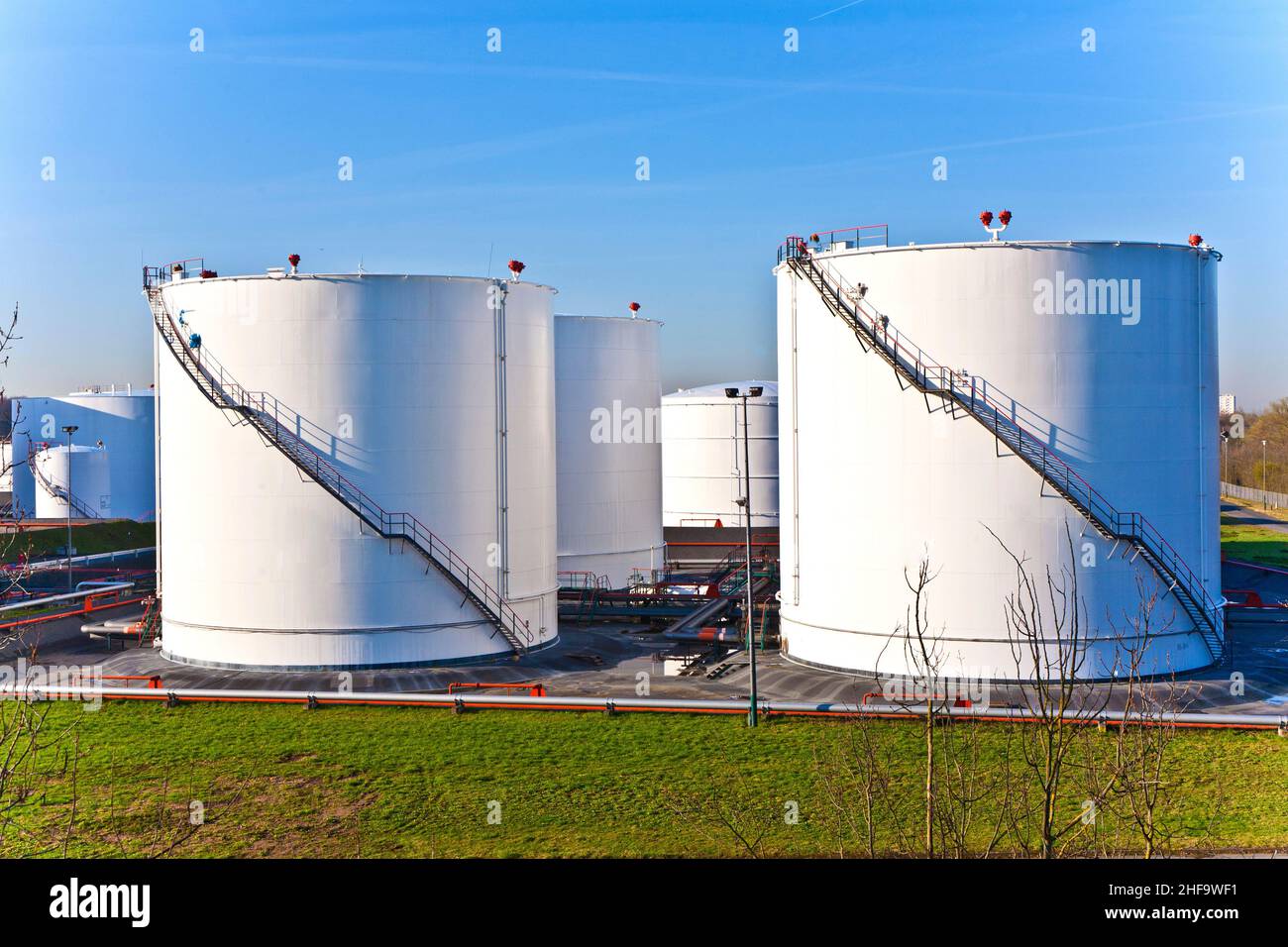 white tanks in tank farm with blue clear sky Stock Photo - Alamy