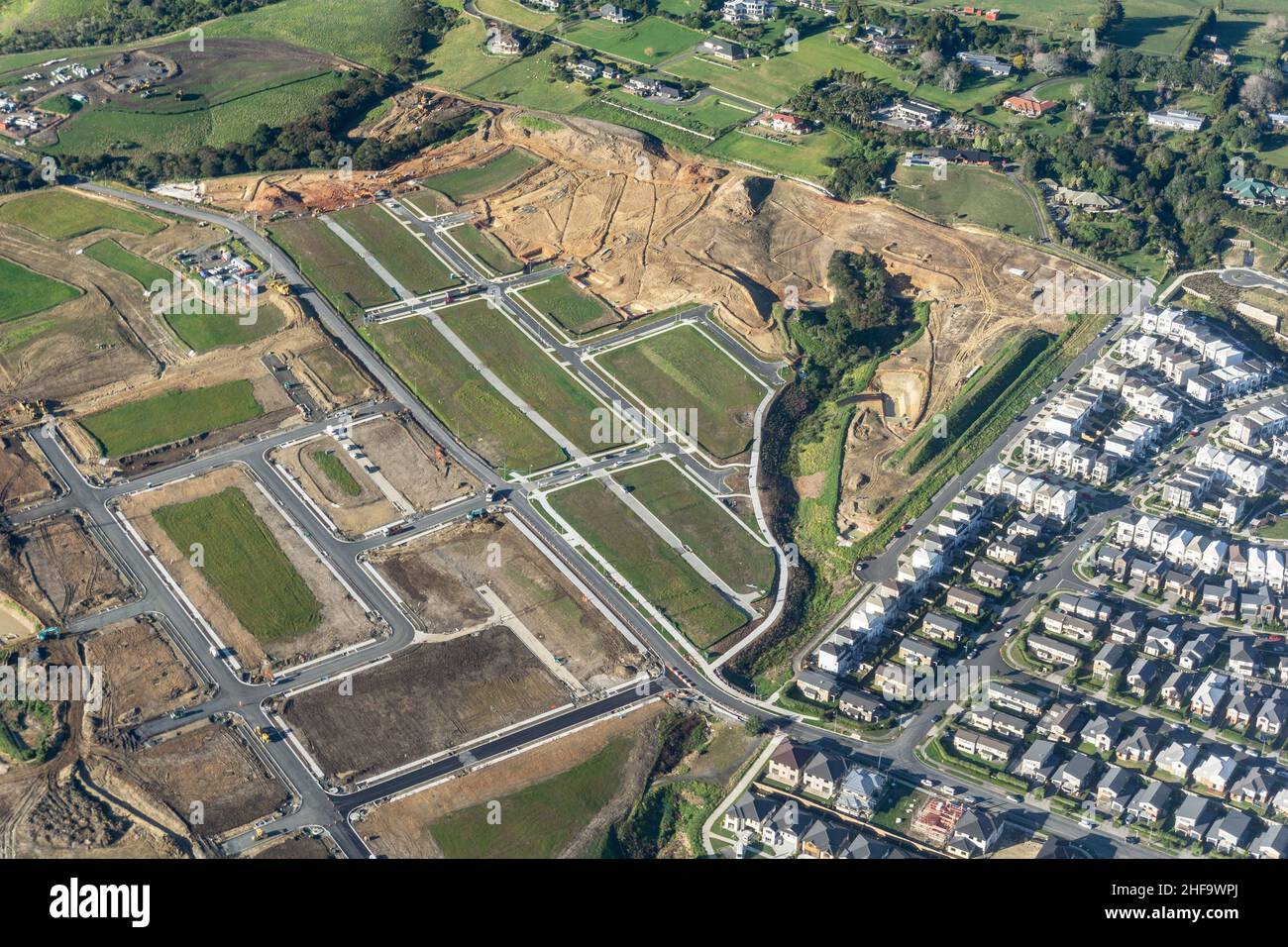 Aerial view new residential subdivision laid out with homes in stages ...