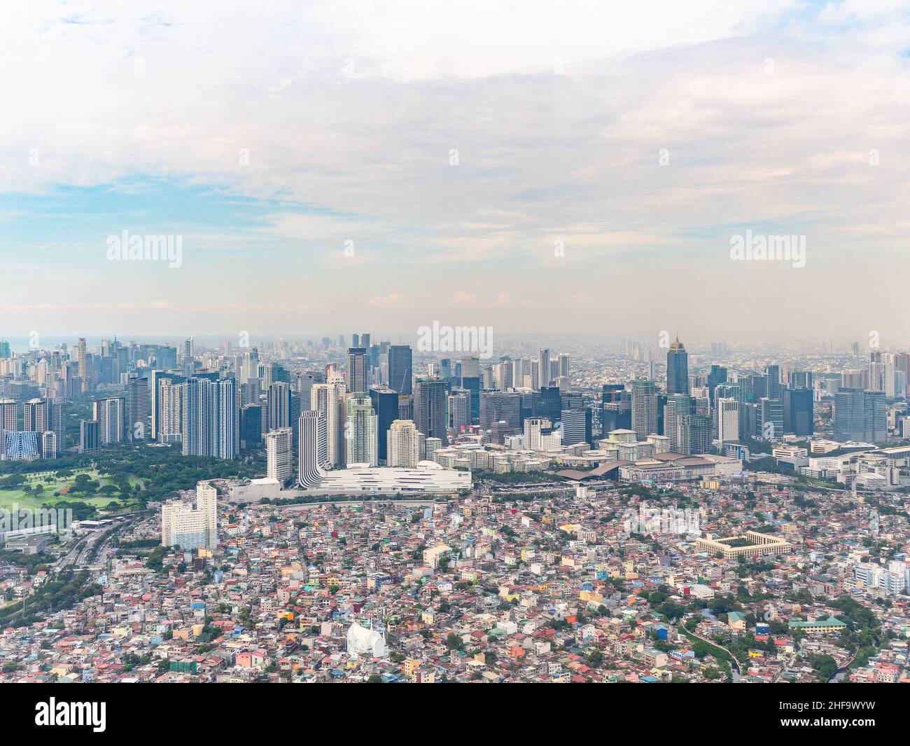 Aerial photo of residential areas in Pembo, Metro Manila, with Bonifacio Global City with its glitzy shopping areas and fashionable high rise building Stock Photo