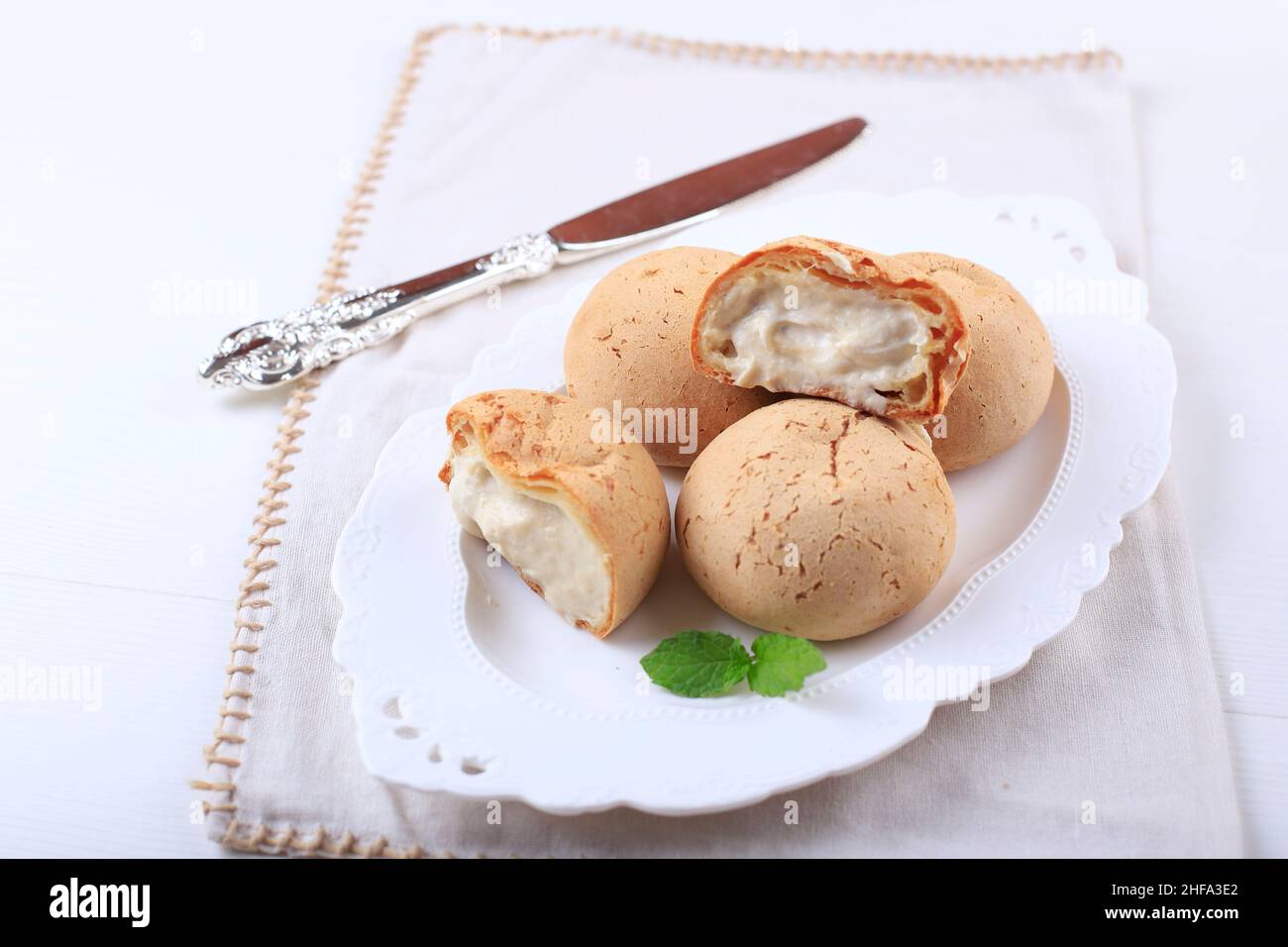 Japanese Mochi Bread with Cream Inside, on White Plate Stock Photo