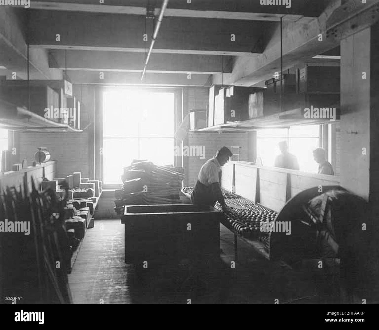 Seattle Hardware Company interior showing employees sorting and packing