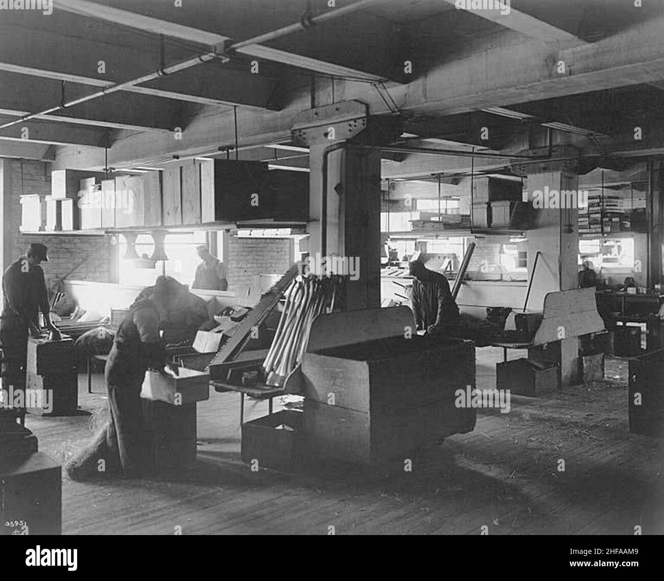 Seattle Hardware Company interior showing employees sorting and packing