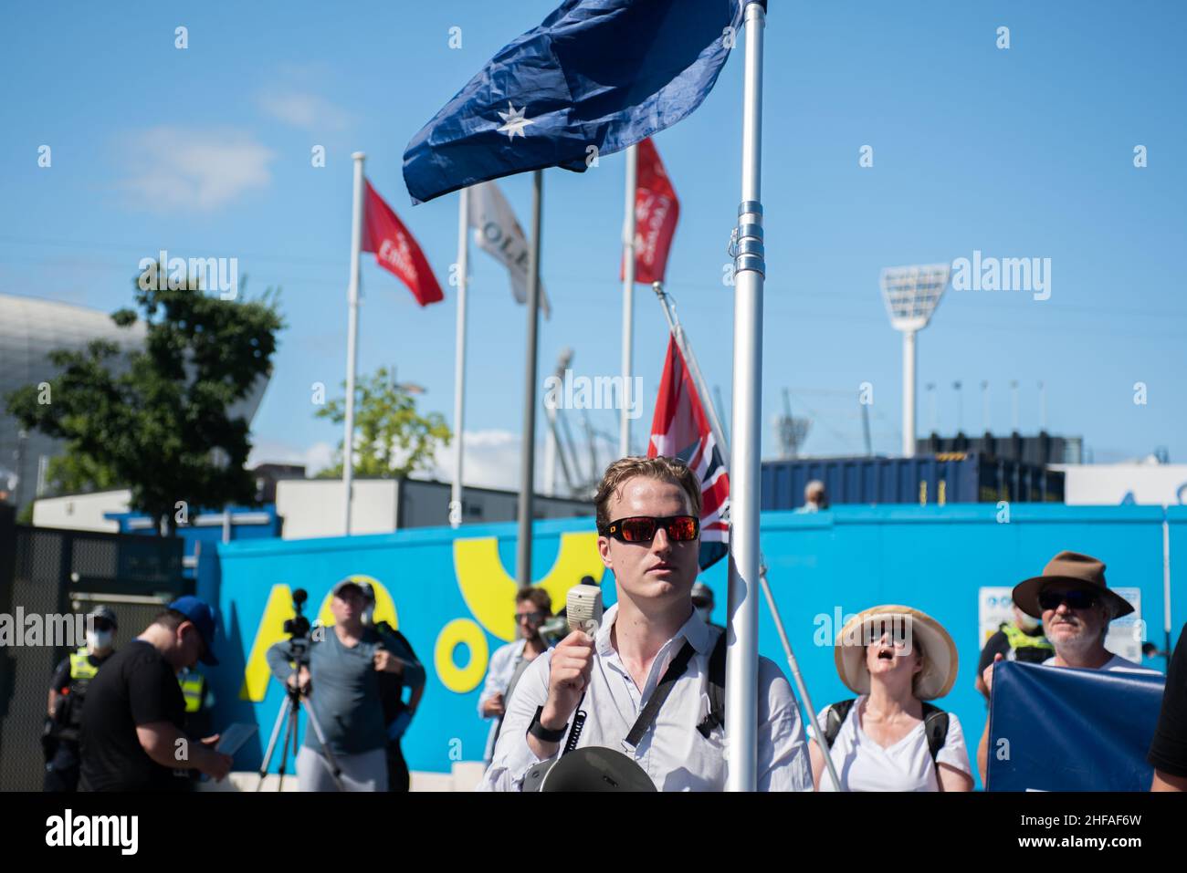 Melbourne, Australia. 15th Jan, 2022. 15th January 2022, Melbourne, Australia. Melbourne Freedom Rally organiser Harrison Mclean leads an anti-vax crowd through a 'Free Novak' chant outside the Australian Open grounds. Credit: Jay Kogler/Alamy Live News Credit: Jay Kogler/Alamy Live News Stock Photo