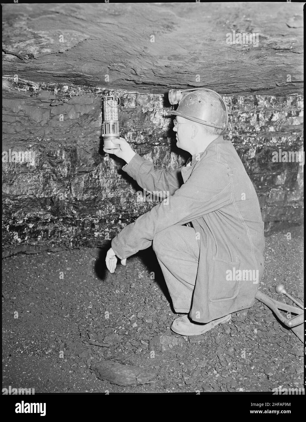 Section foreman testing for gas in corner of a ''room''. Inland Steel Company, Wheelwright ^1