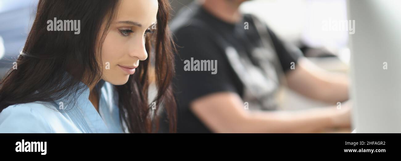 Call center team working at desks in the office Stock Photo