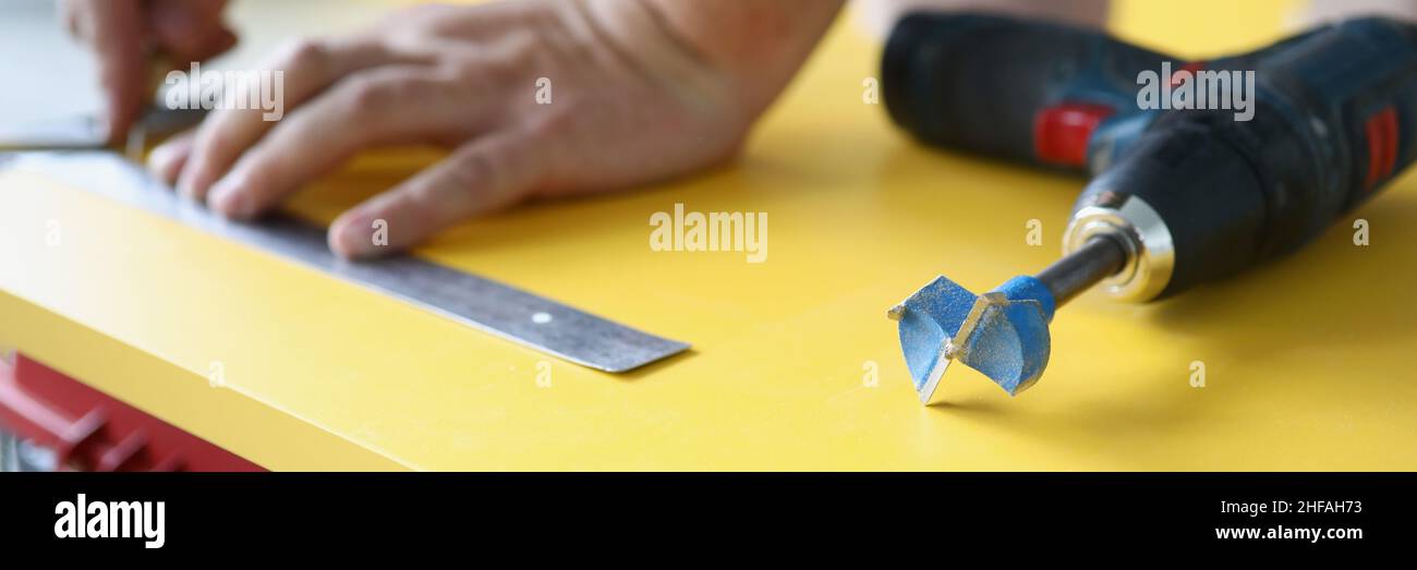 Person Keeping Distance Using A Ruler Hands measure the distance with ruler on the board Stock Photo - Alamy