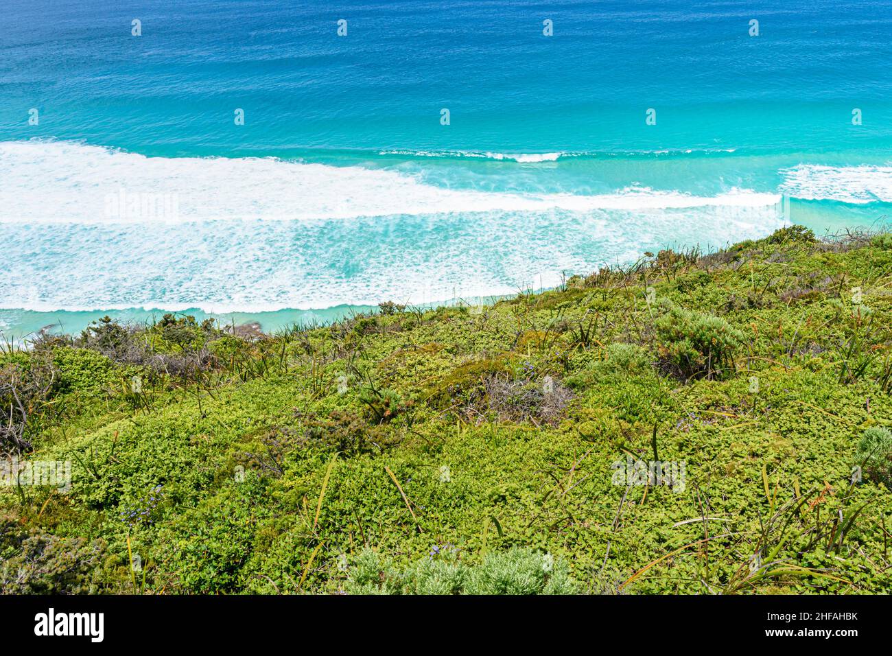 Ocean waves and native coastal vegetation on the Torndirrup Peninsula on the southern coast of Western Australia, Albany, Western Australia, Australia Stock Photo
