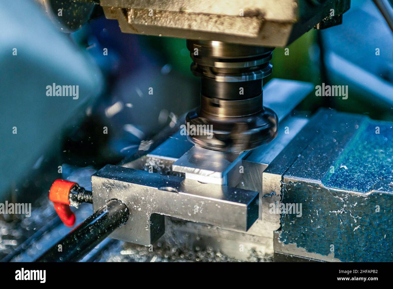 industrial metalworking cutting process by cnc milling cutter machine. Stock Photo