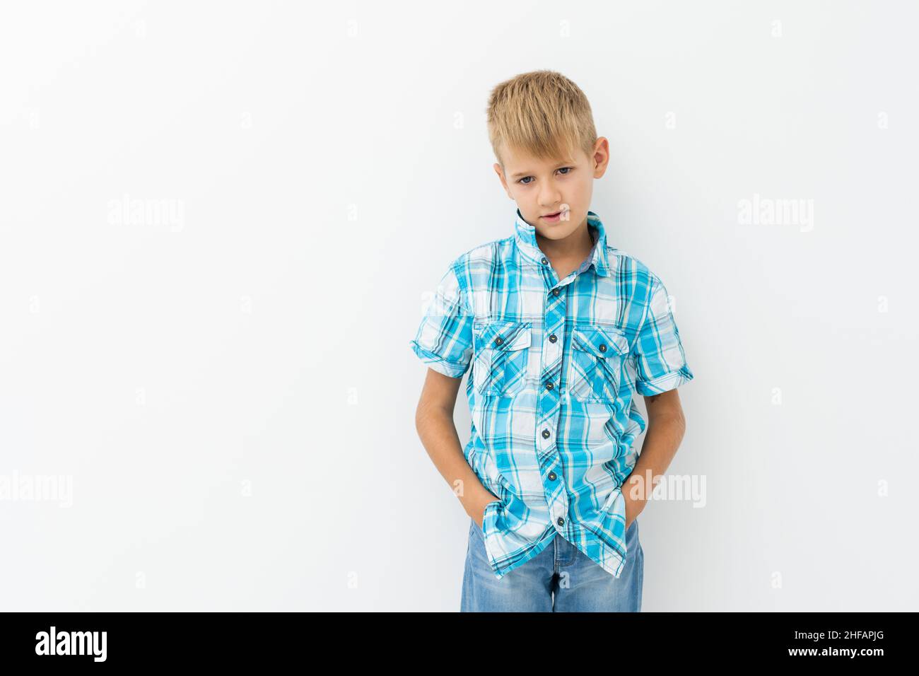 Photo of adorable young happy boy looking at camera Stock Photo - Alamy