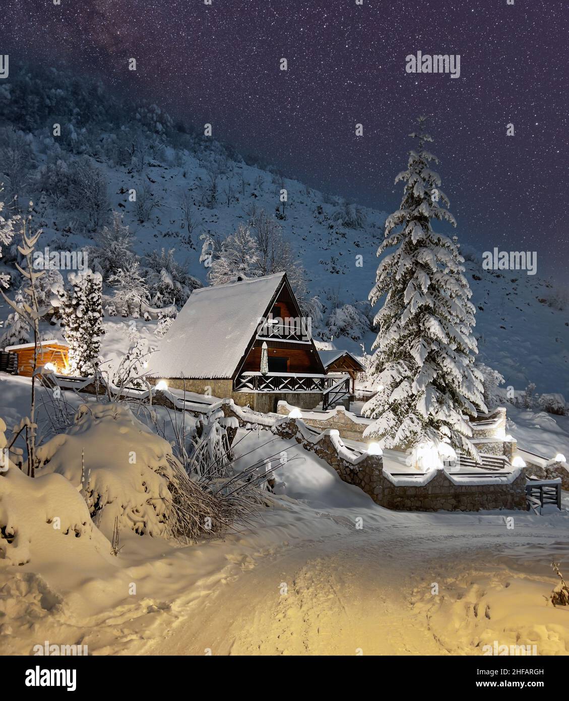 Mountain hut covered in snow on a winter starry night Stock Photo - Alamy
