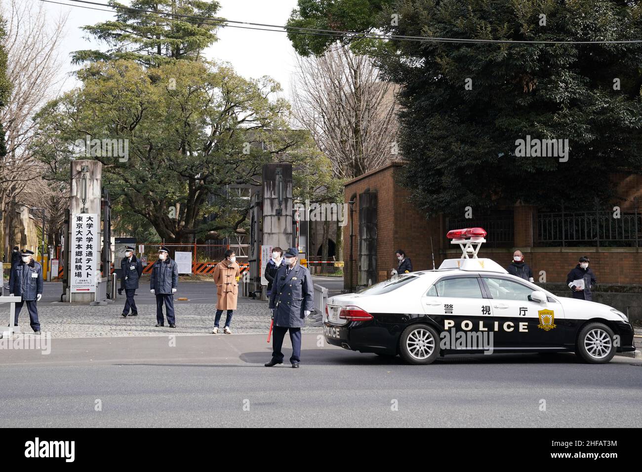 Tokyo, Japan - Police officers and security stand in front of University of Tokyo where a 17-year-old man attacked three individuals with a knife during the nationwide unified university entrance exams in Tokyo, Japan on January 15, 2022. Credit: AFLO/Alamy Live News Stock Photo