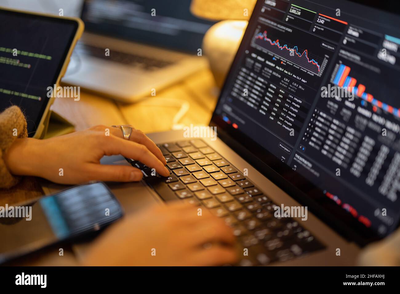 Working on programming dashboard on laptop Stock Photo