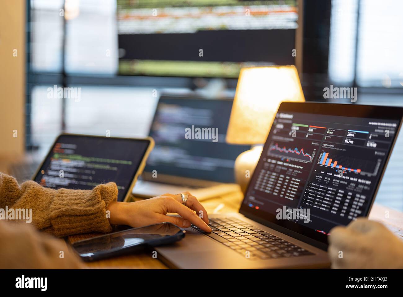 Working on programming dashboard on laptop Stock Photo