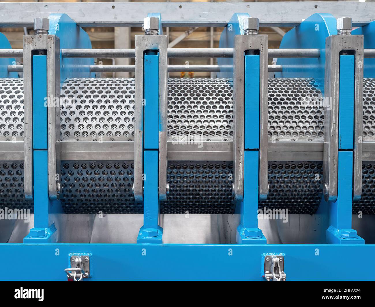 Detail of industrial twin screw press with screens, bridges and locks. Stock Photo
