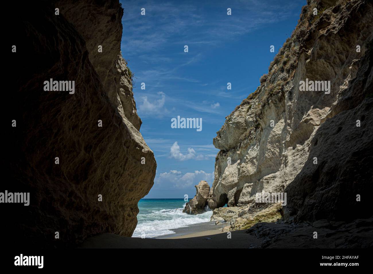 High Rocks Italy High wave breaking on the rocks of the coastline in Italy Stock Photo ...