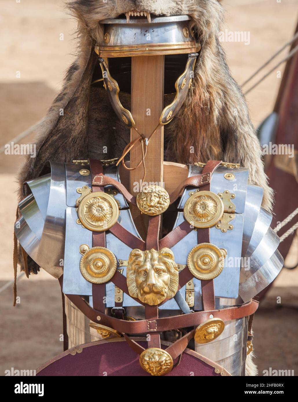 Signifer equipment or standard bearer of the Roman legions. These roman officers covered their helmets with wolf furs Stock Photo