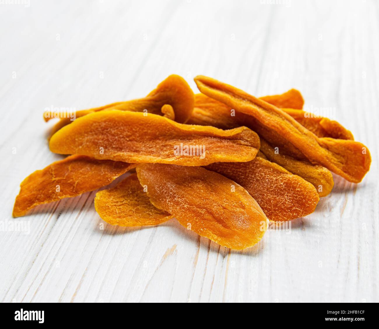 Dried Mango Fruit on Old Wooden Background Stock Photo
