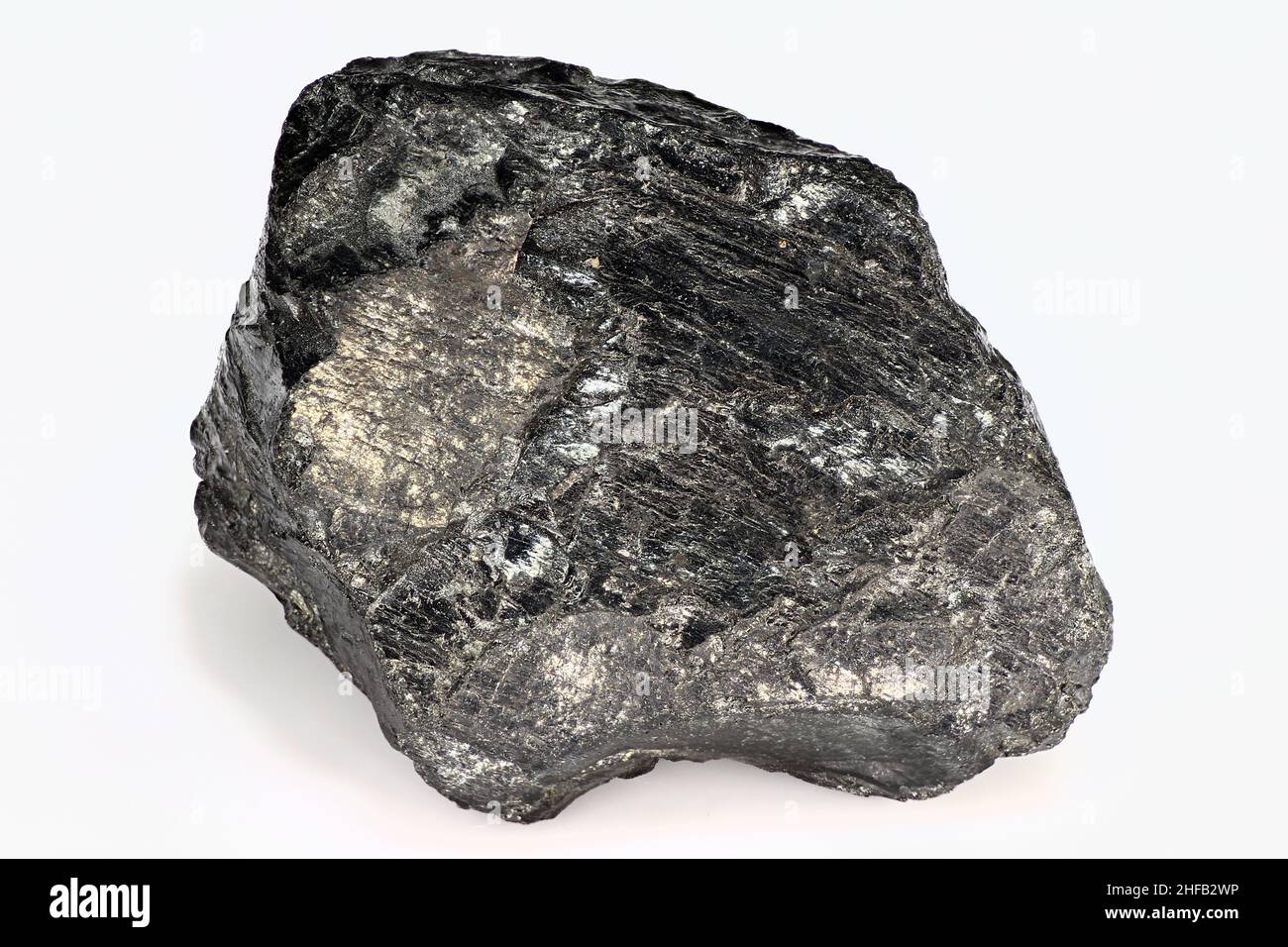 Black piece of coal on a white background close up isolated Stock Photo