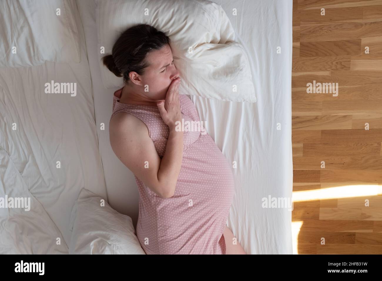 Mature woman sleeping in bed hi-res stock photography and images - Alamy