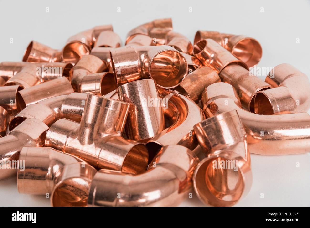 Group of fittings on a white background. Copper fittings for pipe connections. Technical basis