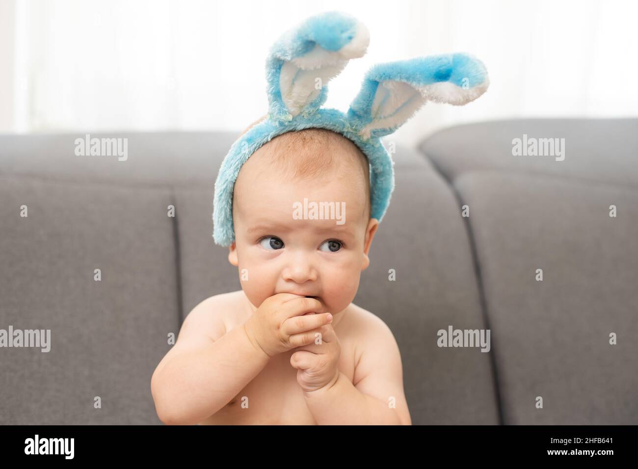 Portrait of a cute baby dressed in Easter bunny ears Stock Photo Alamy