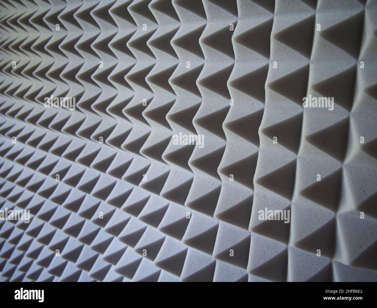 Grey acoustic foam rubber. Soundproof pyramids, full frame Stock Photo