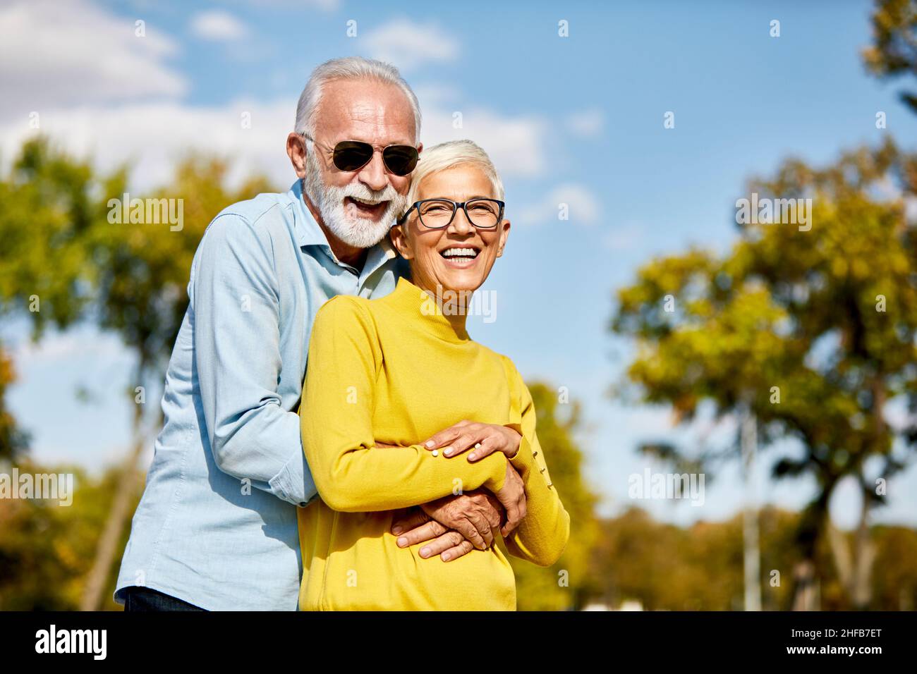 senior couple happy elderly love together cheerful smiling portrait holding hands woman retirement man Stock Photo