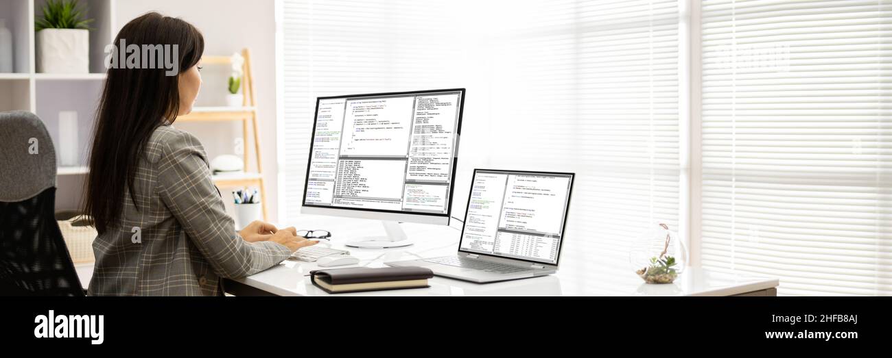 Programmer Woman Coding On Computer. Coder Girl Stock Photo - Alamy image.