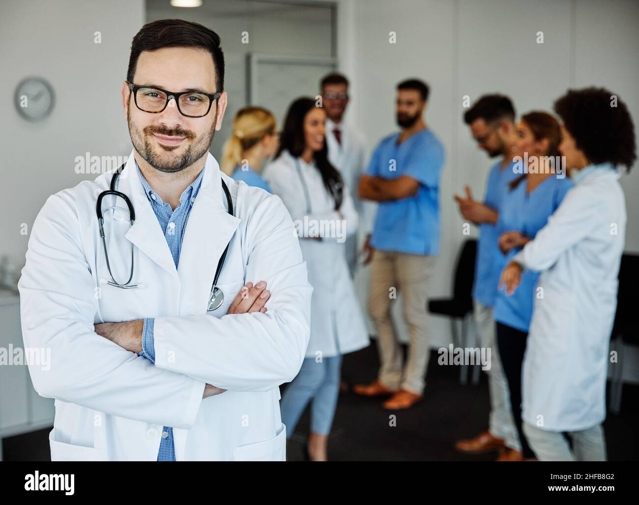 doctor medicine health care hospital specialist physician uniform portrait medical team clinic man smiling Stock Photo