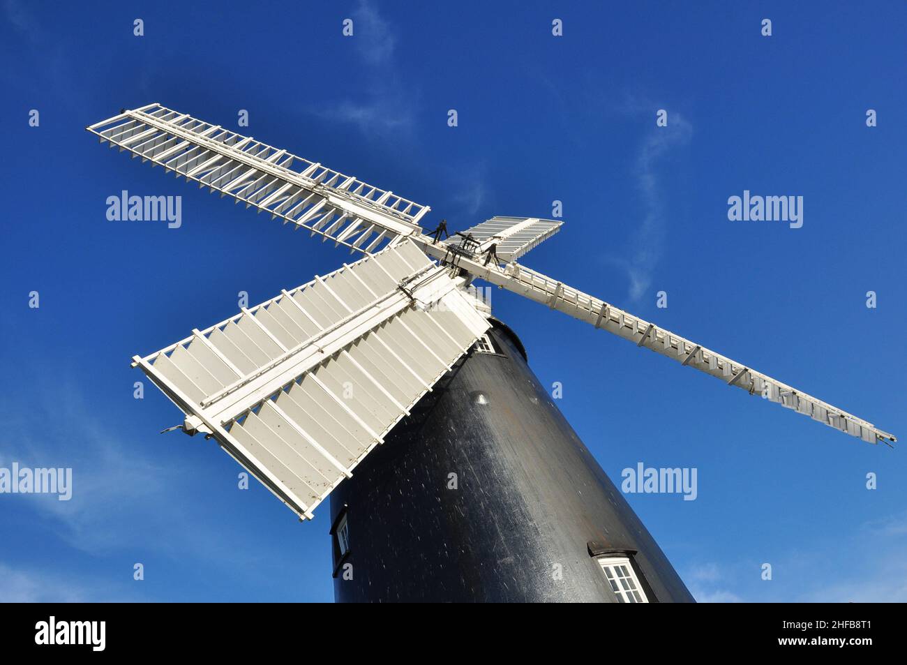 Restored windmill (tarred clunch four storey tower mill built in 1820) in the village of Burwell, Cambridgeshire, England, UK Stock Photo
