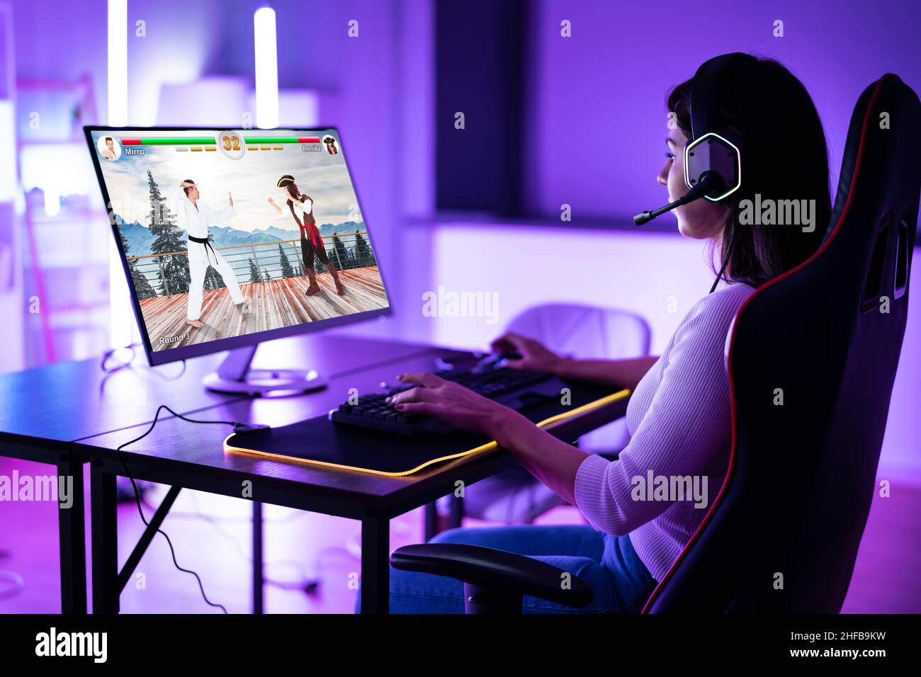 Happy Pretty Blonde Gamer Girl Playing Online Video Game on Her Personal  Computer Stock Photo - Alamy