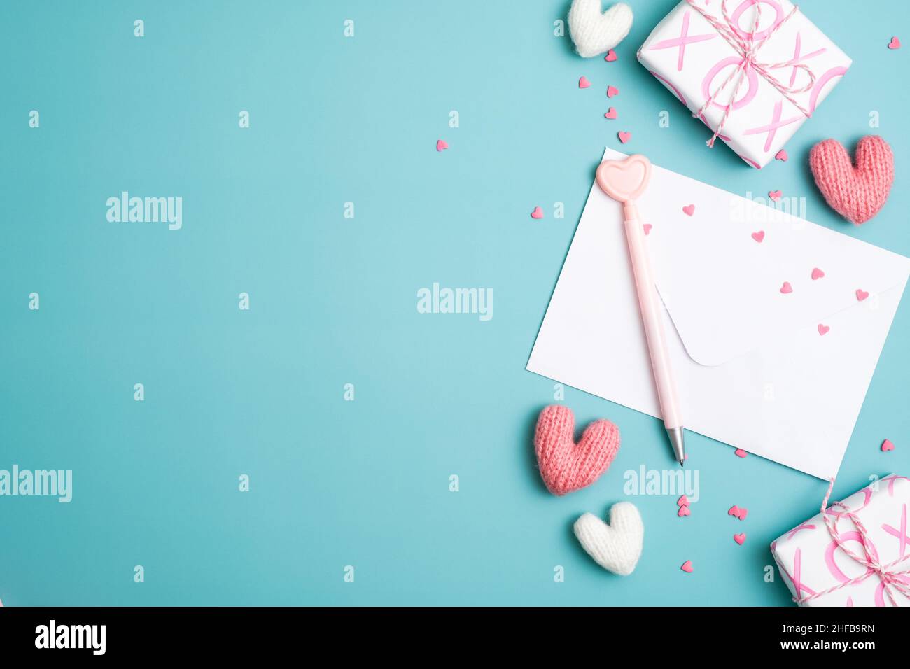 Happy Valentine's day concept. Love letter, gift boxes, hearts on blue ...