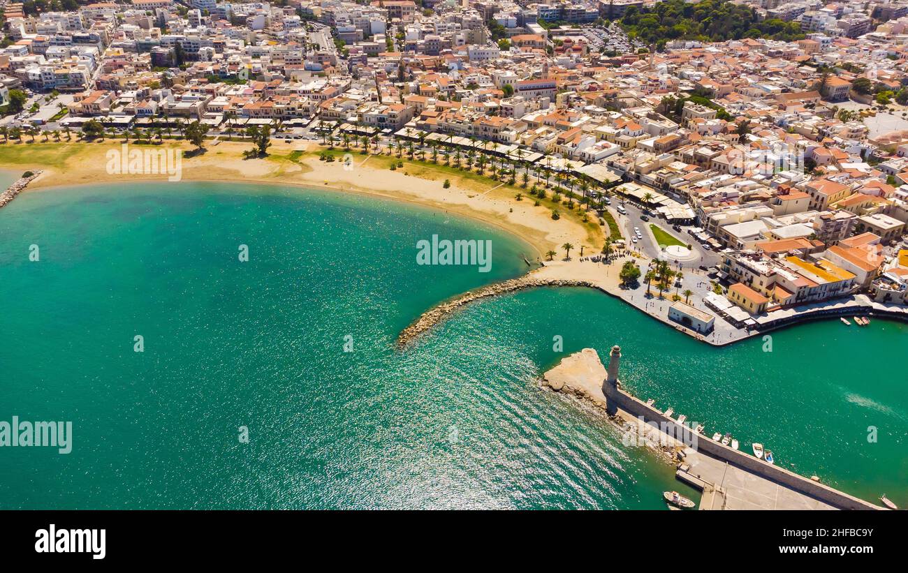 Crete, Greece. Harbor with marine vessels, boats and lighthouse. Rethymno Stock Photo