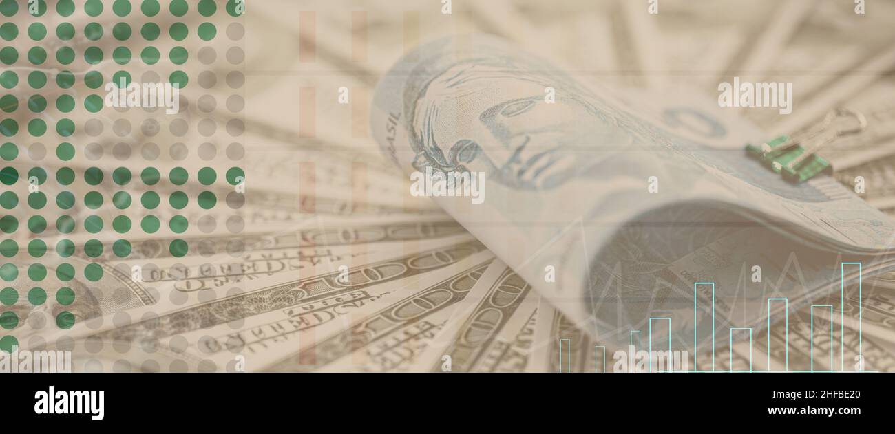 american money surrounding a hundred reais banknote from brazil, stock exchange image with money texture and lines indicating rise and fall Stock Photo