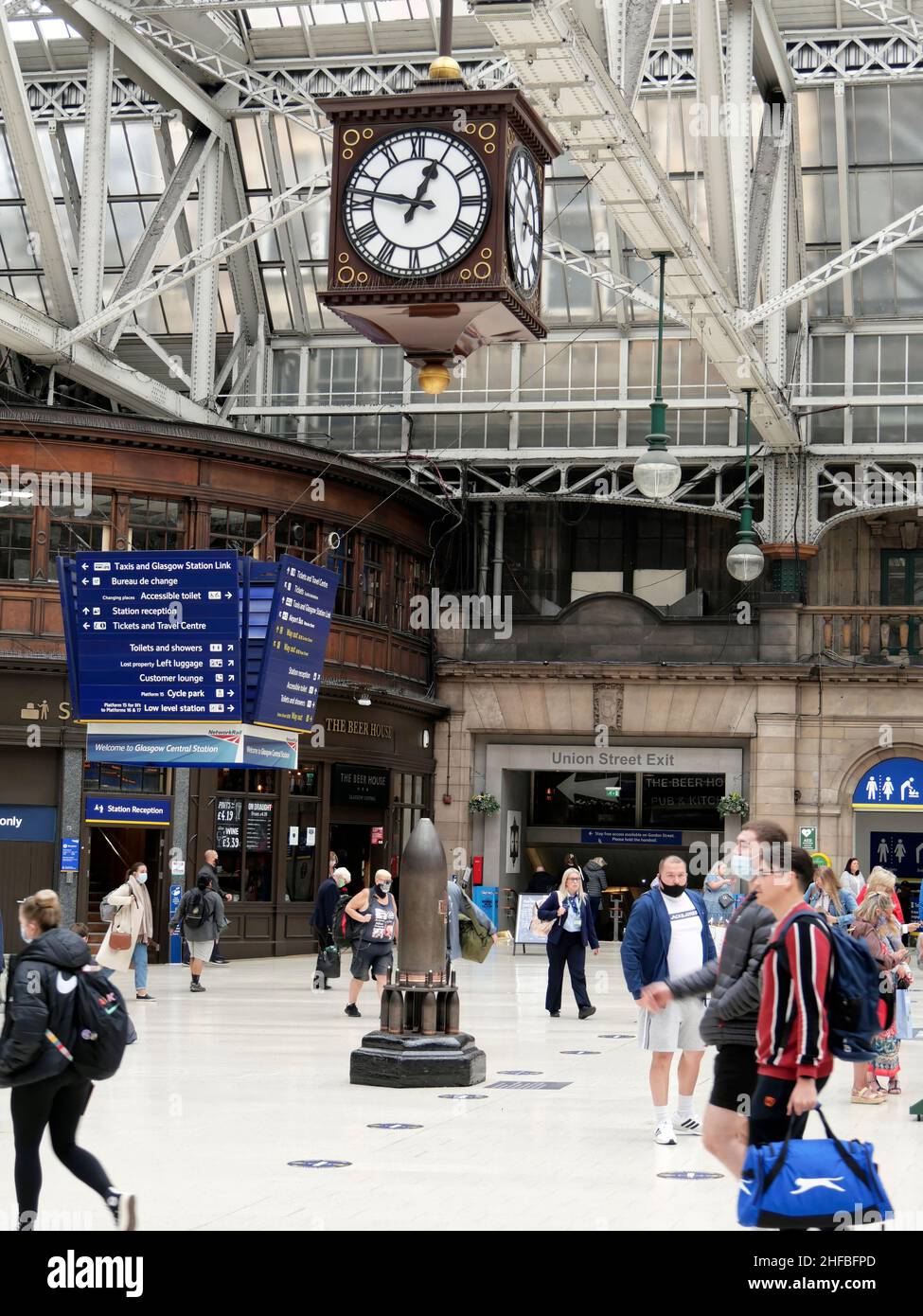 under the clock is a popular meeting place in Central Station,Glasgow